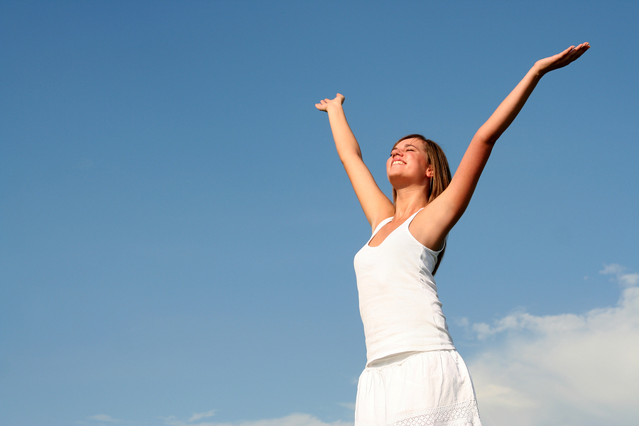 bigstock-Woman-Raising-Arms-Above-Her-H-1963271